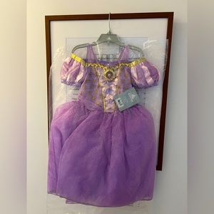 Brand new with tags Disney Store Tangled Rapunzel Dress, size 4